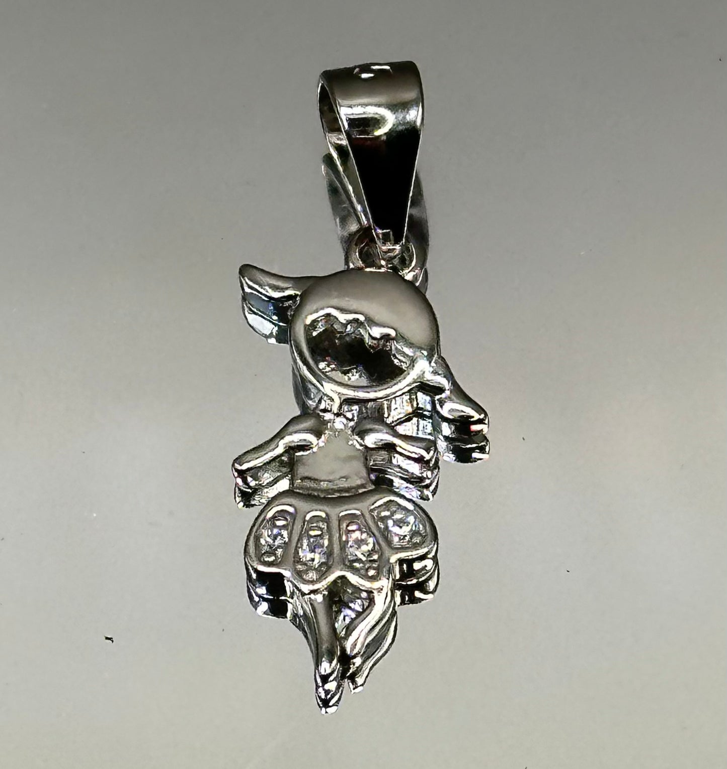 Silver dancer’s pendant