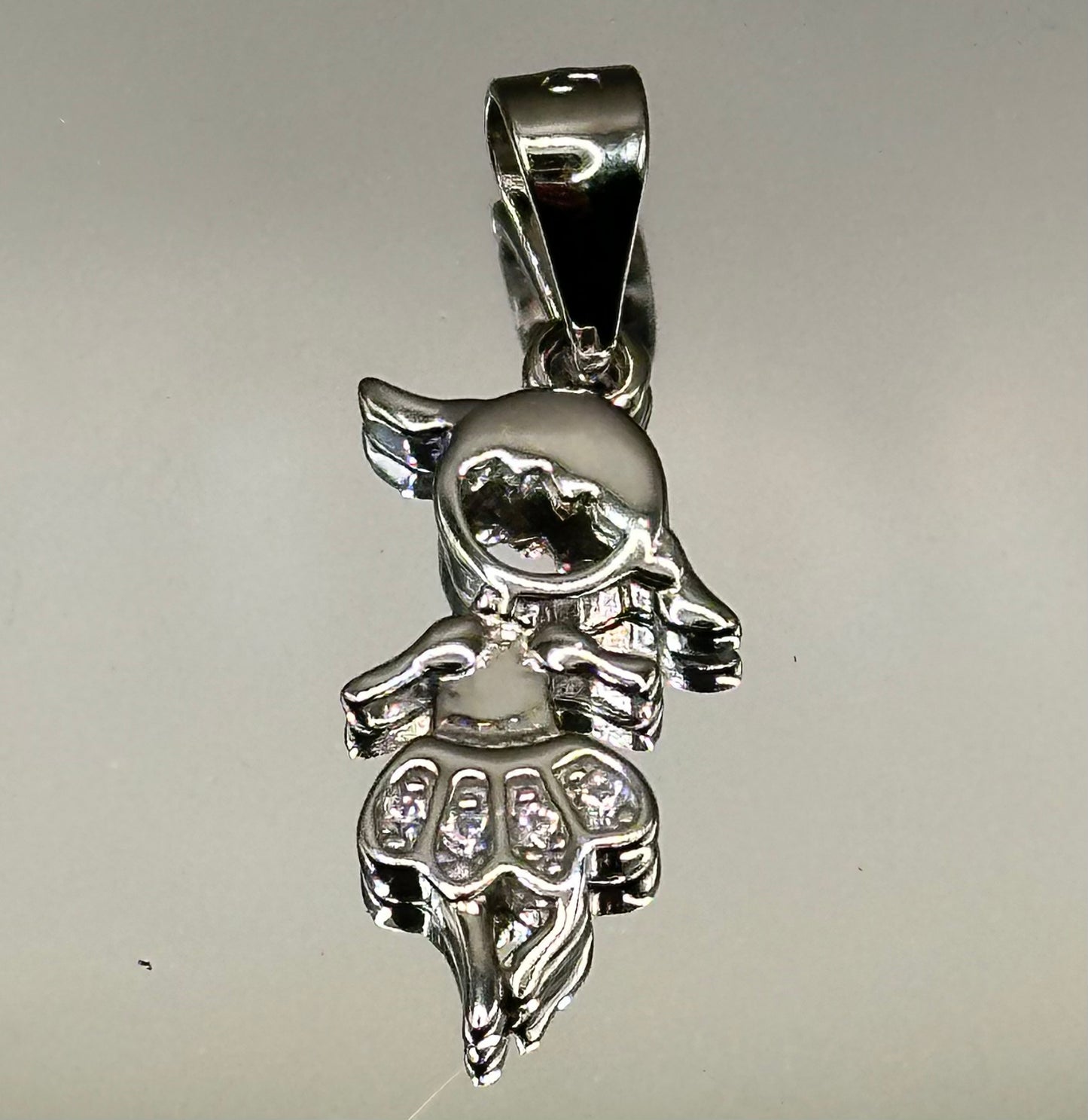 Silver dancer’s pendant